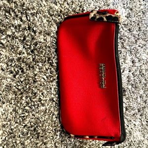 Used bag; it’s in good condition red and cheetah print on sides.